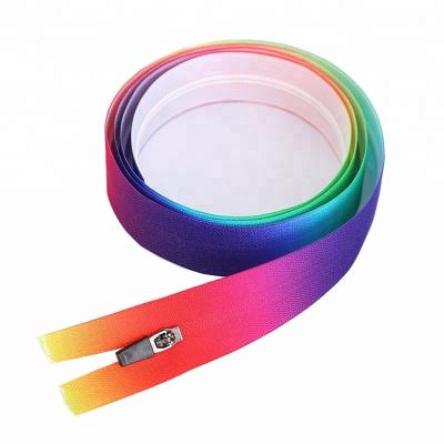 China 3# Raincoat Knocked Down White Waterproof Zipper Tape With Gradient Printing YG Rubber Slider Pull For Kids Clothes for sale