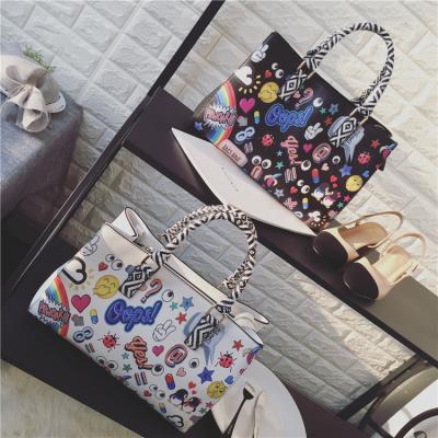 China High Quality New Product Cartoon Printing Graffiti Handbag Large Capacity Lady Bags Shoulder Bag Good Quality Messenger for sale