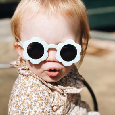 China Hot Selling Popular Eyewear Trade Boys Girls Round Lovely UV400 Children's Sunflower Kids Plastic Sunglasses for sale