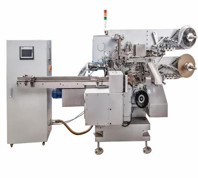 China Food factory price foil brush wrapping machine for packaging chocolate pralines and compressed candy for sale