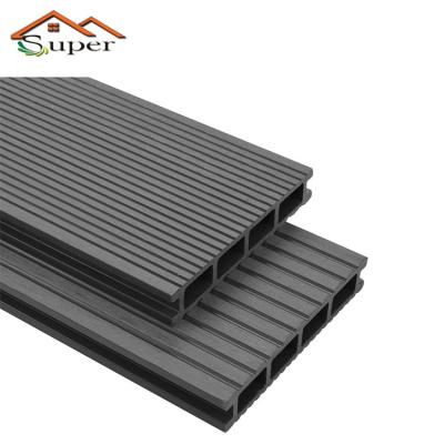 China Waterproof Foshan Classic Grooving Interlocking Gray Wpc Decking Hollow Decking Tiles Outdoor for sale