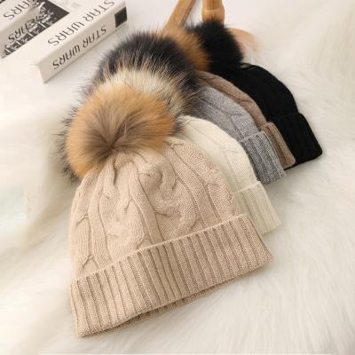 China JOINT winter women's cable knit ny beanie hat with real fox fur pom pom for sale