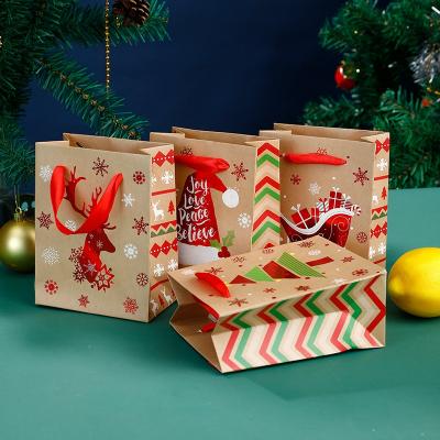 China Recyclable Wholesale Eco-friendly Christmas Gift Cardboard Paper Bag With Ribbon Handle Handbag Present Packaging Hot Stamping Printing for sale