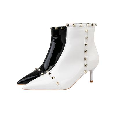 China Rubber Style Slimming Rivet Women's Home Boots Women's Short Skinny Pointed-Toe Boots Joker Martin Boots Women for sale