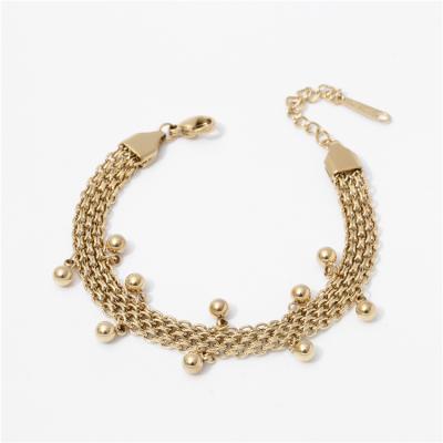 China Environmental Friendly Elegant Women Tie Bead Charms Bangle Stainless Steel Gold Plated Adjustable Bangle for sale