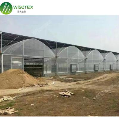 China Low Cost Waterproof Prefab Multi-span Vegetable Retractable Greenhouse for sale