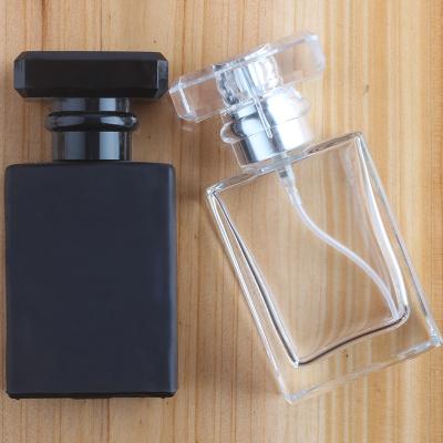 China 30ml 50ml Cosmetic Empty Refillable Square Perfume Spray Glass Bottle With PS Cap for sale