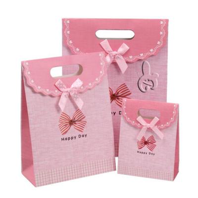 China 2022 Hot Sale Wholesale Custom Baking Sticky Portable Paper Bag Flip Birthday Candy Gift Bag Bow Bag Recyclable for sale