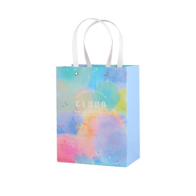 China 2022 New Arrival Recyclable Simple Creative Paper Bag Design Hand Gift Ins Colorful Pattern Paper Bag With Handle Custom Wholesale for sale