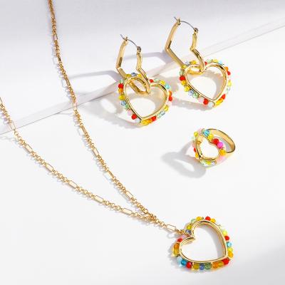 China Environmentally Friendly Women's Colorful Seed Beads Hollow Out Big Heart Necklace Earring Ring Gold Plated Jewelry Set for sale