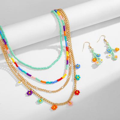 China Eco-Friendly Boho Summer Girl Women Daisy Flower Fashion Handmade Seed Bead Tassel Beaded Earrings and Necklace Set for sale