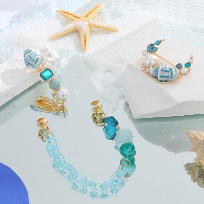 China Wholesale 2022 Summer Women Ocean Blue Resin 3D Shell Conch Brooch Pin Phone Strap Chain Hair Clip Environmental Friendly for sale