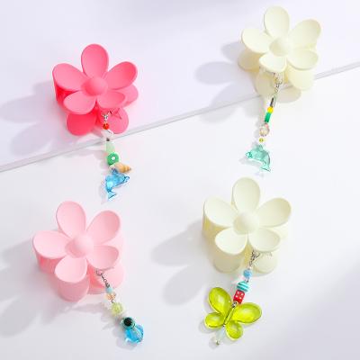 China Hair Accessories Bulk Sweet Pink Tassel Hair Claw With Butterfly Chain Tassel Matte Frosted Acrylic Flower Claw Cuts Women Girl for sale