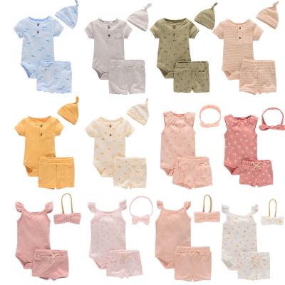 China 3Pcs Breathable Custom Organic 100% Cotton Baby Clothing Set Summer Solid Colors With Unisex Hat And Headband for sale