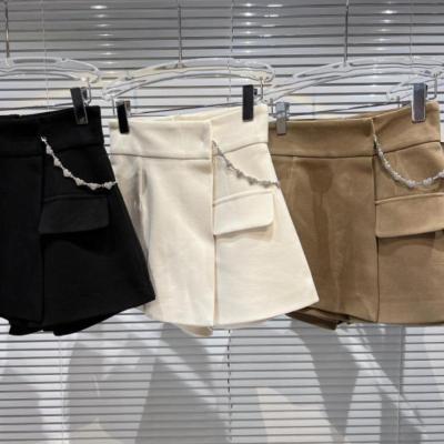 China Autumn New Solid Color Sweet Spring Women's Spring Sweet Pantskirt Fashionable Fake Skort One Line Two Piece Metal Waist Chain Pantskirt for sale