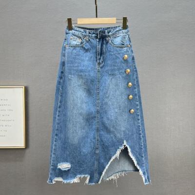 China New Spring Denim Skirt Soft Workable Mid Length High Waist Denim Skirt Loose Slimming Holes Fashion Blue A Line Skirt For Women for sale