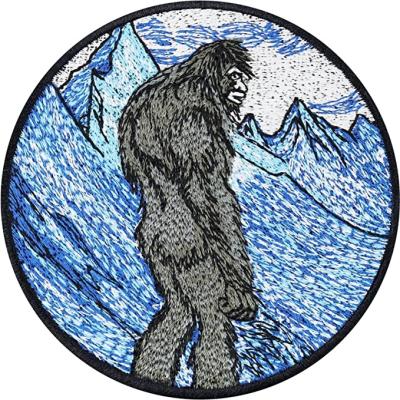 China Sustainable Wholesale mystical snow mountain wild man embroidery patch custom clothing accessories ironing patch custom emblem logo for sale