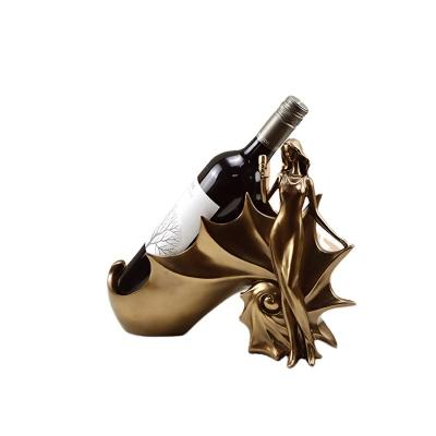 China Europe and America Retro Illustration Fan Beauty Conch Hot Selling European Resin Opens Cold Cast Copper Wine Rack for Home for sale