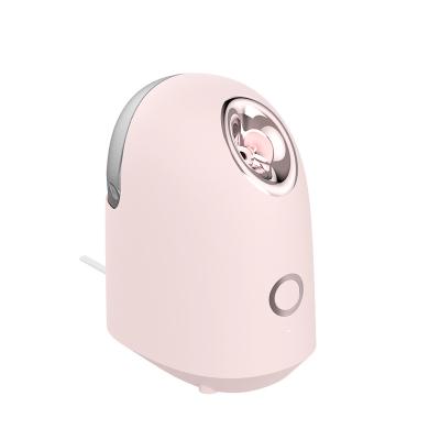 China Portable Nano Electric Facial Multifunctional Warm Skin Mist Spray Nourishing Face Steamer Handheld Steamer for sale