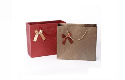 China Promotional Printed Laminated Paper Carrier Bags Round Handle Paper Cloth Bags for sale