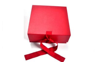 China Red Folding Gift Packaging Box With Magnet for Closure And Ribbon Crosed for sale