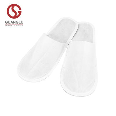 China Travel Hotel SPA Airline Home Airbnb Disposable Nonwoven Hotel Slipper With 3mm EVA Sole Pressed White for sale