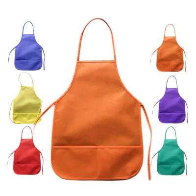 China 100% Eco-Friendly Custom Designs Kids Non-woven Fabric Painting Apron Kids Eco-Friendly Patterns With Pockets for sale