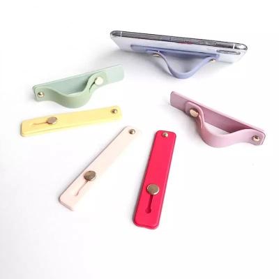 China Universal Finger Ring Holder Bracket Wrist Ring Holder Push Stretch Pull Grip Finger Ring Silicone Hand Band Phone Holder for sale