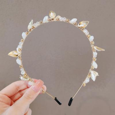 China Hot Selling Designer Headbands Crystal Flower Shell Hairbands Metal Headband Pearl Headband for sale