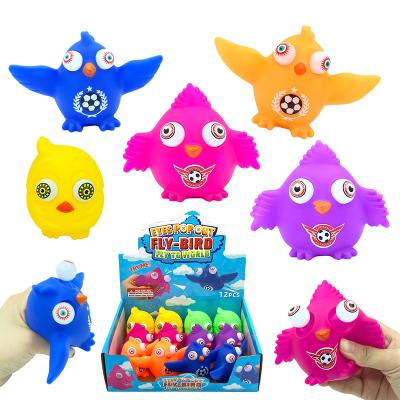 China Cute Sensory Eye Poping Trigger Pushing PVC Wiggle Plastic Toy Printing Soccer Ball Cartoons Fly Bird Sound Eye Out Of Squeeze Toy for sale