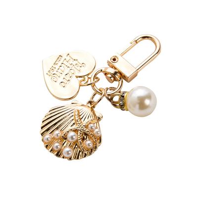 China Metal& 2022 New Arrivals Designer Llaveros Pearl Key Chain Metal Conch Loose Cute Peach Shell Key Chains For Women Handbags Luxury Gifts for sale