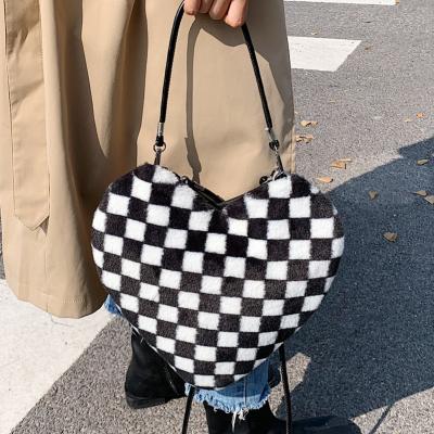 China Fashion Winter Faux Fur Handbags Heart Shape Women Purses and Plaids Black and White Handbags for sale