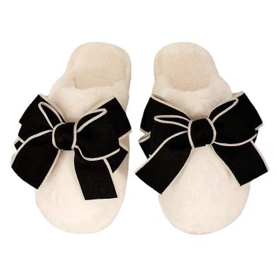 China Fashion Trend Winter Girls Bow Slippers Faux Fur Indoor Slippers Cute Furry Fuzzy Ladies Slippers for sale