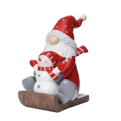 China Funny Christmas Floor Decoration Secret Skiing Santa Snowman Statue Sleigh Xmas Jolly Resin Boss Best for sale