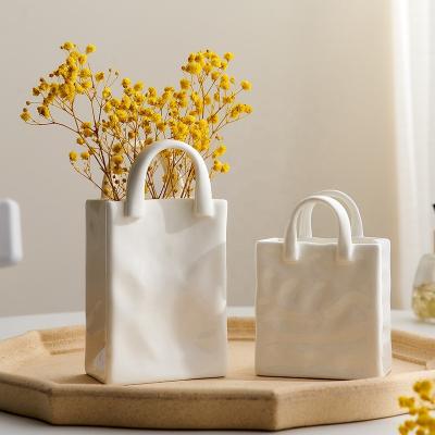 China Modern Novelty Home Decoration Dried Flower Arrangement Tote Bag Ceramic Vase for sale