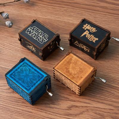 China OEM New Arrival Custom Mini Hand Crank Laser Engraved Wooden Music Box for sale