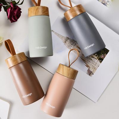 China 2022 Viable Custom Logo Outdoor Sport Portable String Metal Stainless Steel Lid Vacuum Flasks Water Bottle Wooden Mug Thermos Flasks for sale