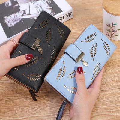 China New Waterproof Fashionable Laser Perforated Hollow Sheet Shaped Ladies Purse Multi-card Two Long Fold For Women for sale