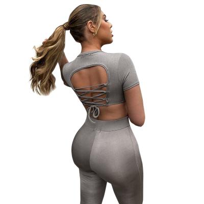 China 2021 Products QUICK DRY Fashionable Solid Colors Bandage Backless Crop Top Workout Set Women Teams Jogger Pants Two Piece Set for sale