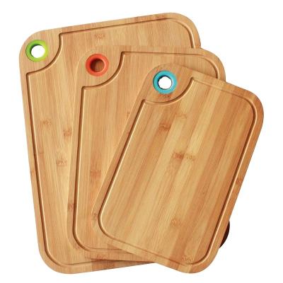 China Sustainable Newly Design Bamboo Cutting Board Set Chopper With Silicone Ring For Meat And Vegetables for sale