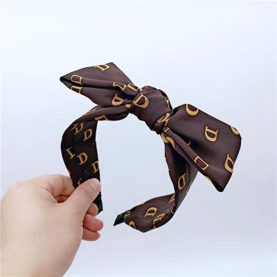 China Wholesale designer popular South Korea style new sells elegant retro wide edge temperament bow knot lady hair circle for sale