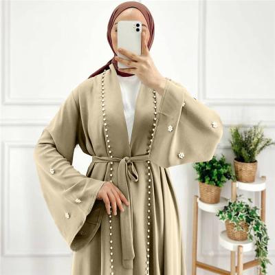 China Modest Muslimah Styling 2022 Solid Color Inlaid Pearl Dubai Open Abaya Muslim Women Muslim Dress for sale