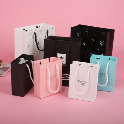 China Custom Recyclable Shopping Clothing Boutique Shopping Bag Printing Logo Gift Paper Bag Paper Packaging With Handle for sale