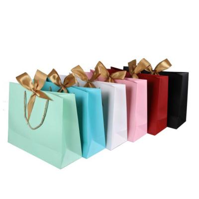 China Recyclable Gift Bags Customized Printing To Recycle Cardboard White Luxury Paper Bag With Ribbon Handle for sale