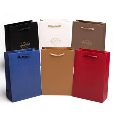 China Luxury Recycled Materials Ribbon Handle Boutique Shopping Packaging Customized Printed Euro Tote Paper Gift Bags With Logo for sale