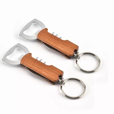 China Viable Custom Multifunctional Wooden Key Chain Handle Wine Opener Logo Keyring Bear Bottle Opener for sale