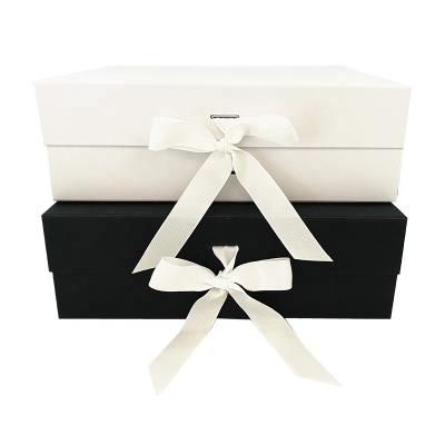 China Recyclable Luxury Black Folding Tote Boxes Wedding Magnetic Gift Boxes With Ribbon for sale