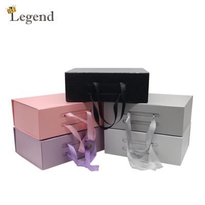 China Wholesale Recyclable Rigid Cardboard Packaging Boxes Custom Design And Size Luxury Popular Foldable Box With Ribbon Handle for sale