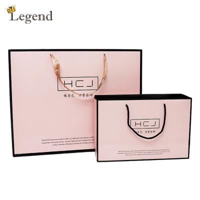 China Recyclable Pink Color Paper Bags Factory Supply Eye-catching Modern Branded Paper Bag Tote Bag for sale