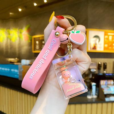 China Acrylic cute furry liquid head chain pom pom pom pom nail computer pendant crystal teacup crystal teacup boba key chain nail pom for sale